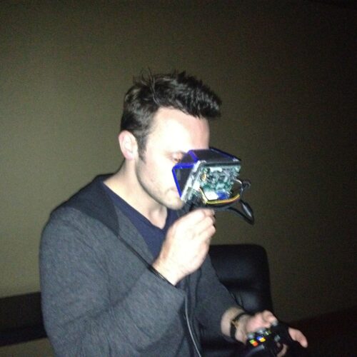 Oculus VR CEO Brendan Iribe looking at a Rift prototype in 2012.
