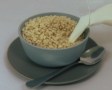 Photo of milk being poured into a bowl of puffed rice