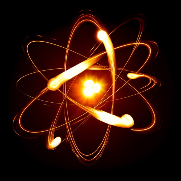 Artist's drawing of a nucleus with electrons orbiting it, all glowing orange
