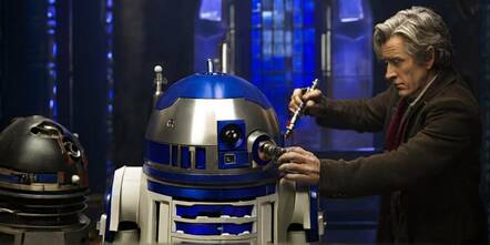 Doctor Who fixing R2D2 with a sonic screwdriver